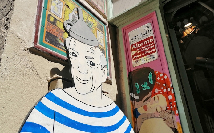 Picasso mural on a Barcelona street during the walking tour with museum entry.