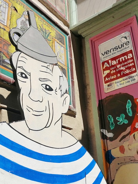 Picasso mural on a Barcelona street during the walking tour with museum entry.