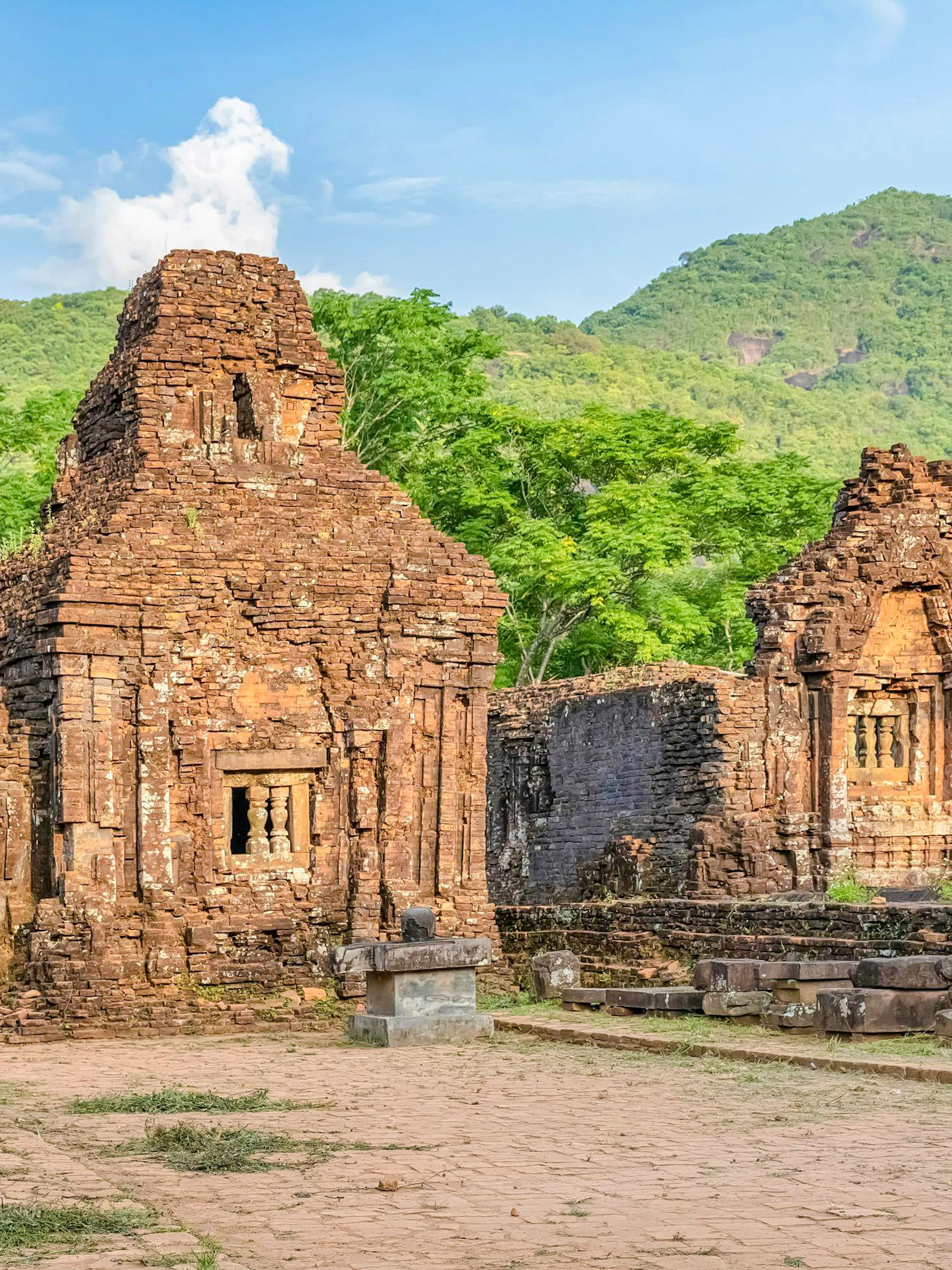 My Son Sanctuary ancient Cham temples in Quang Nam, Vietnam, surrounded by lush greenery.