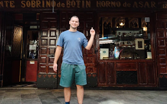 Person standing outside Sobrino de Botín restaurant in Madrid during a private tour.