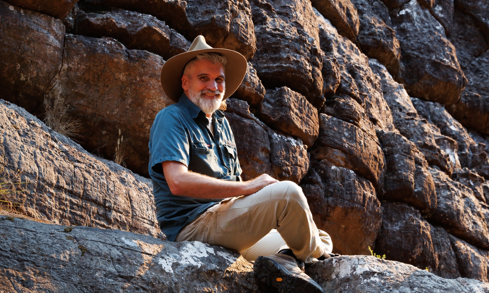 Guide explaining geological features at Grand Canyon viewpoint.