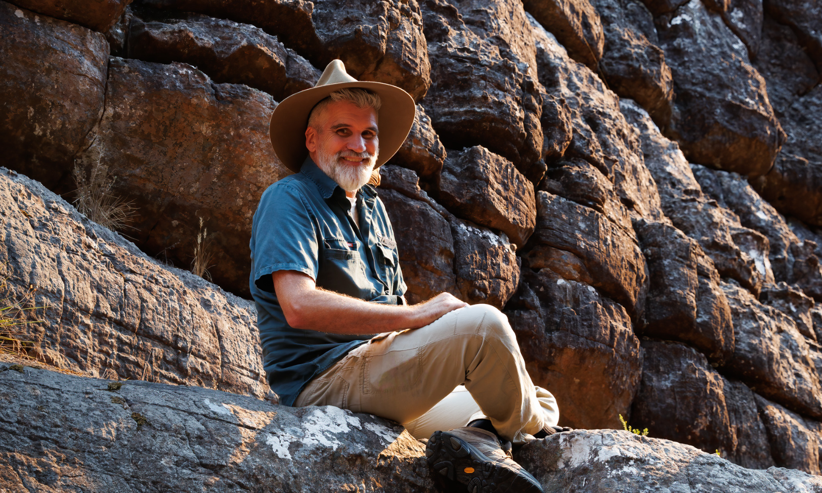 Guide explaining geological features at Grand Canyon viewpoint.