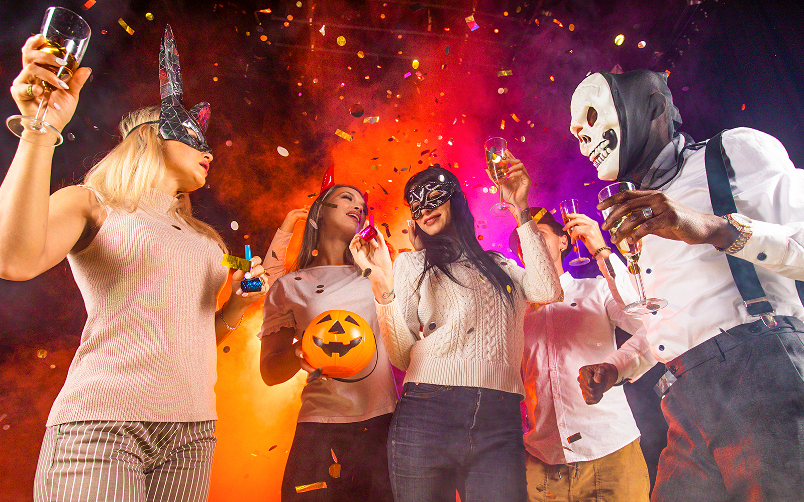 Partygoers in costumes celebrating at Bran Dracula's Castle Halloween event.