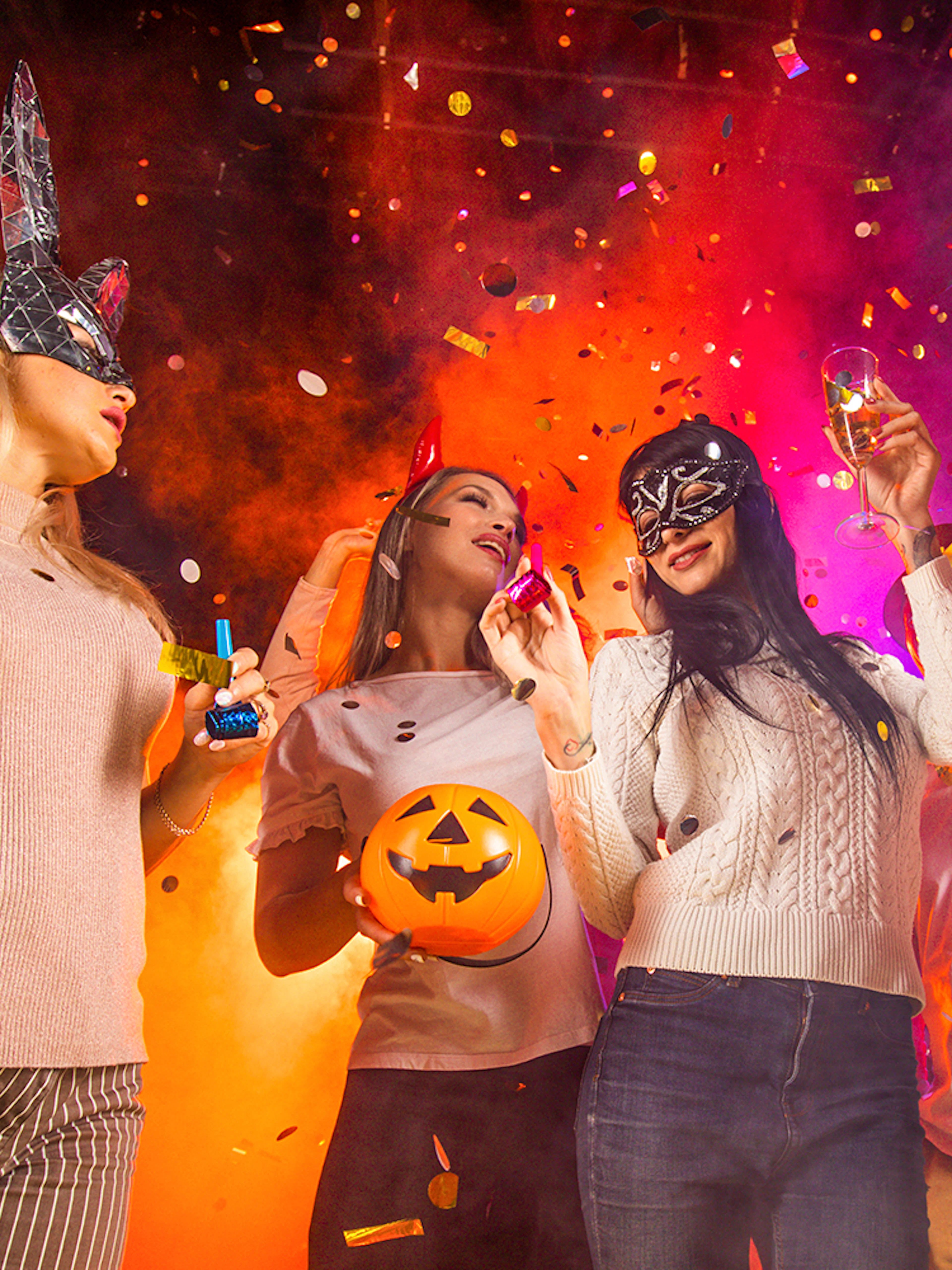 Partygoers in costumes celebrating at Bran Dracula's Castle Halloween event.