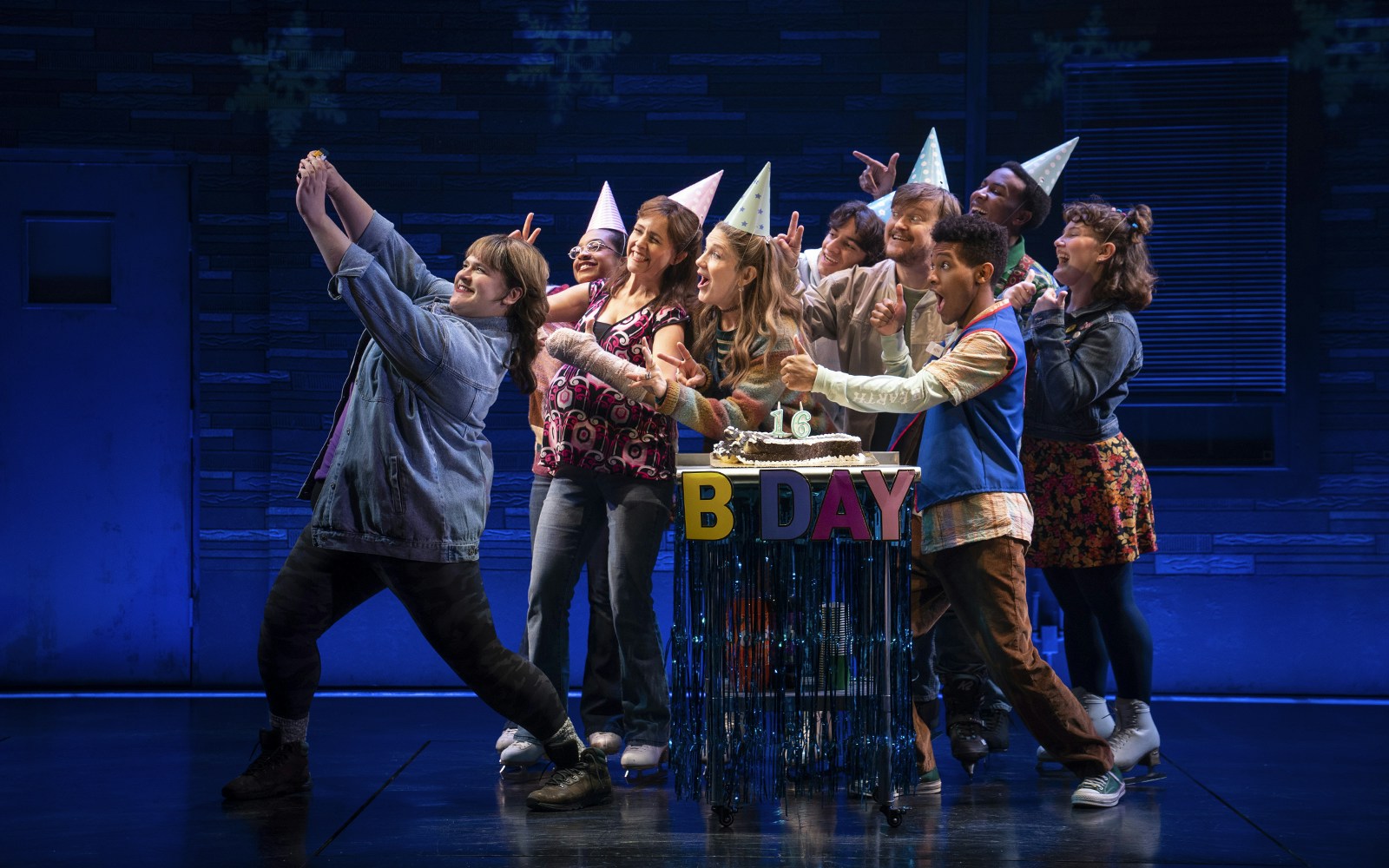 Group celebrating a birthday on stage during the Kimberly Akimbo show.
