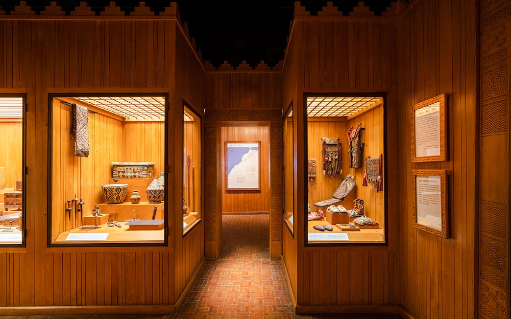 Berber artifacts displayed in wooden showcases at the Berber Museum, Marrakech.