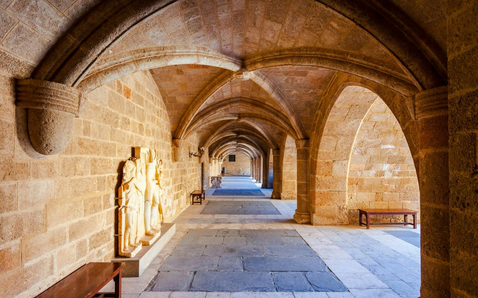 Stone corridor with arches inside the Palace of the Grand Master of the Knights of Rhodes.