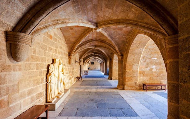 Stone corridor with arches inside the Palace of the Grand Master of the Knights of Rhodes.