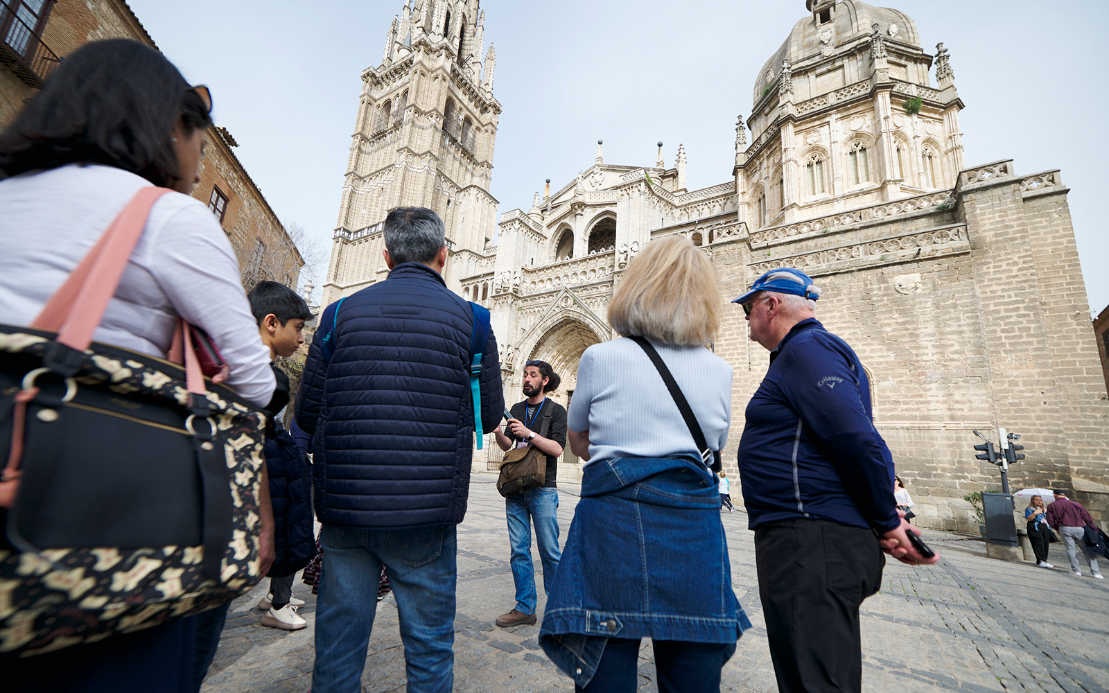 Visitors with their guide outside Toledo Cathedral on a guided tour
