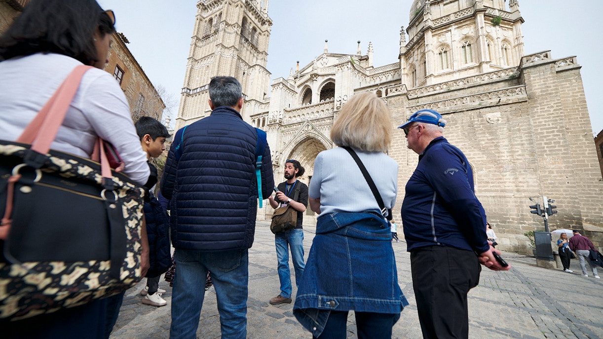 Visitors with their guide outside Toledo Cathedral on a guided tour