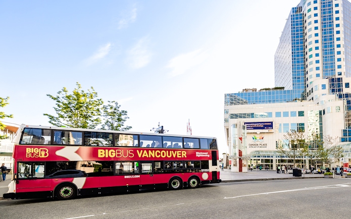 Big Bus Vancouver in front of Canada Place, offering city sightseeing tours.