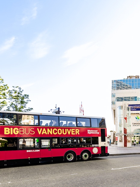 Big Bus Vancouver in front of Canada Place, offering city sightseeing tours.