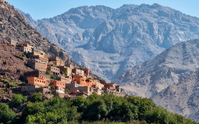 Village in the Ourika Valley with Atlas Mountains backdrop, near Marrakech.