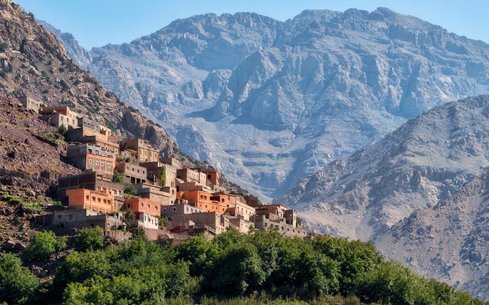 Village in the Ourika Valley with Atlas Mountains backdrop, near Marrakech.