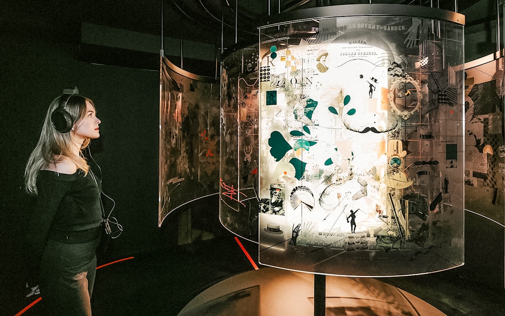 Visitor listening to an exhibit at the Johann Strauss Museum in Vienna.