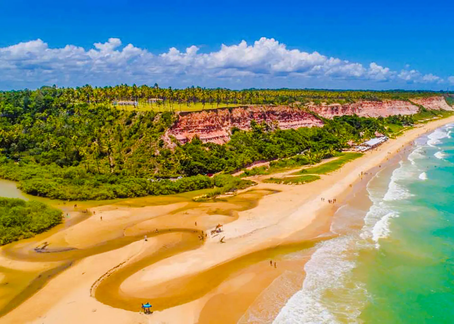 Aerial view of Arraial d'Ajuda beach with cliffs and ocean, Porto Seguro, Brazil.