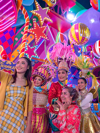 Performers in colorful costumes at Carnival Magic Park Phuket.