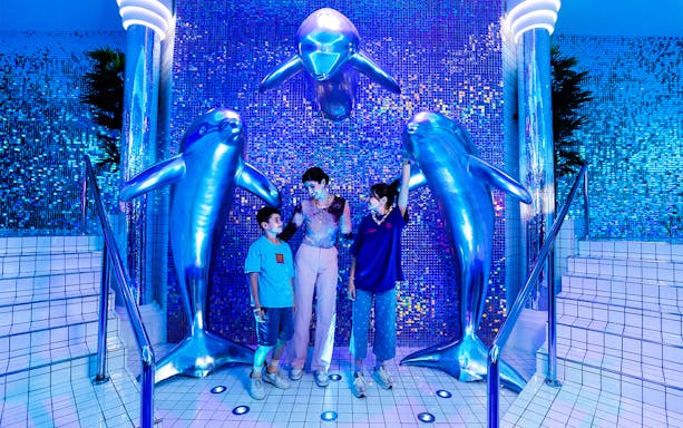 Dubai House of Hype interior with vibrant lights and interactive exhibits.