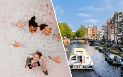 Visitors enjoying The Upside Down Amsterdam and a canal cruise boat on Amsterdam's waterways.
