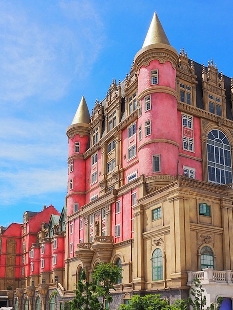 Luna Castle in Ba Na Hills, Da Nang, Vietnam with pink and gold towers.