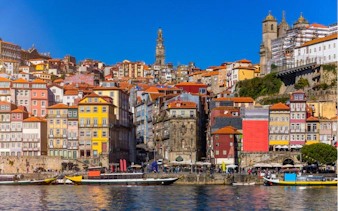 Colorful Ribeira district buildings along the Douro River in Porto, Portugal.