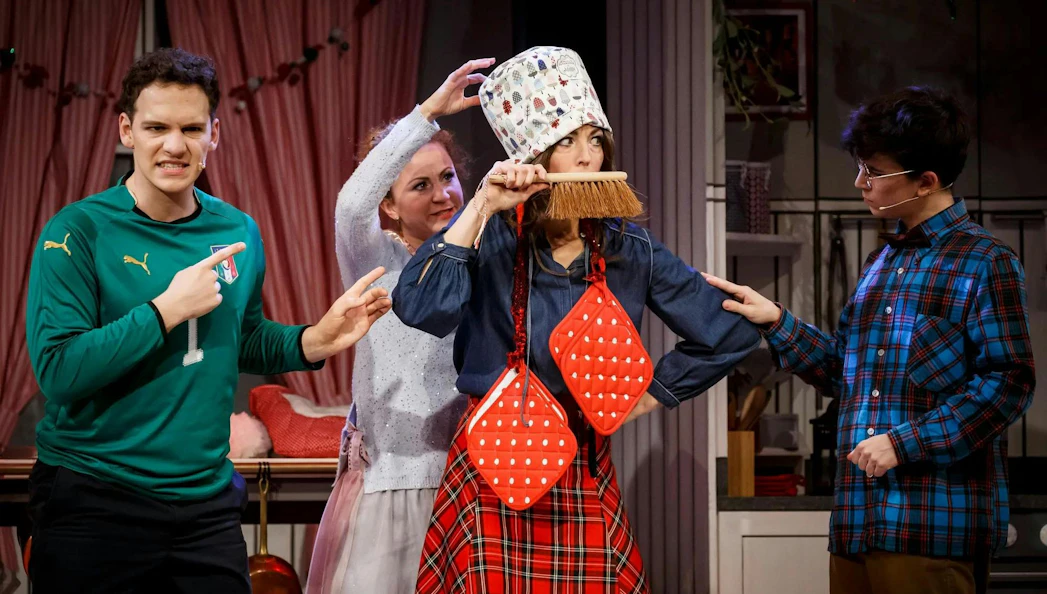 Actors performing a comedic scene in The Christmas Bakery play, Stuttgart.