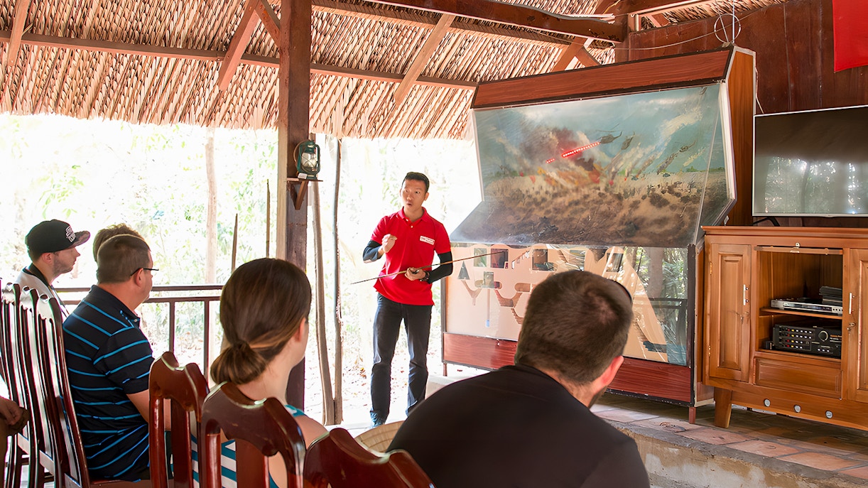Guide explaining war strategies at Cu Chi Tunnels, Ho Chi Minh City, Vietnam.
