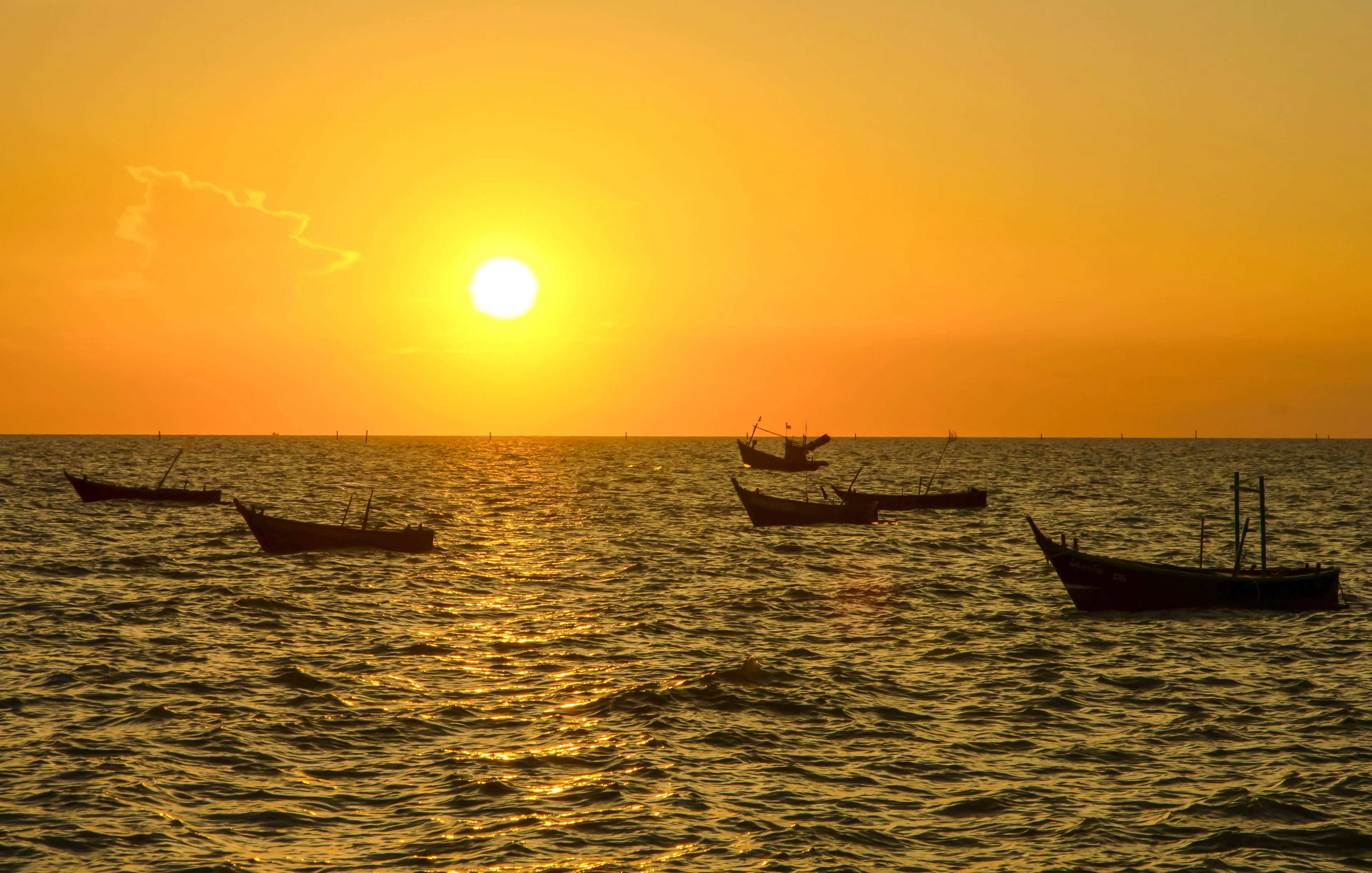Boats floating on the sea at sunrise in Nice.