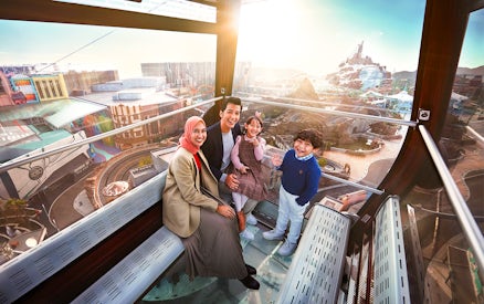Family enjoying view inside Genting Awana SkyWay Cable Car, Malaysia.