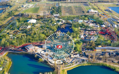 Aerial view of Mirabilandia Park with Ferris wheel and roller coasters, Italy.