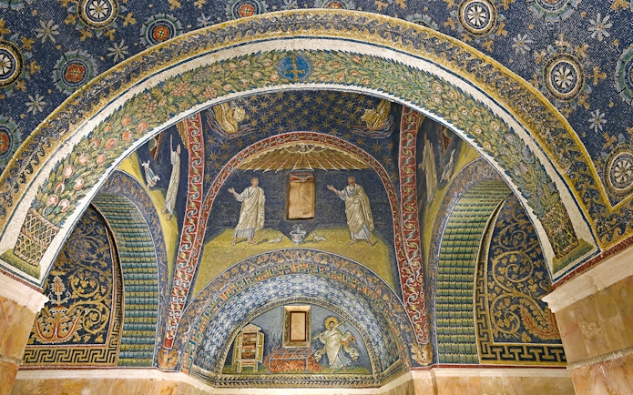 Ravenna mosaic ceiling with intricate designs and religious figures in Galla Placidia Mausoleum.