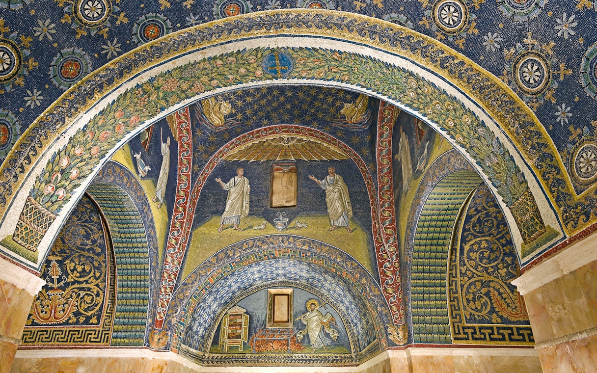 Ravenna mosaic ceiling with intricate designs and religious figures in Galla Placidia Mausoleum.