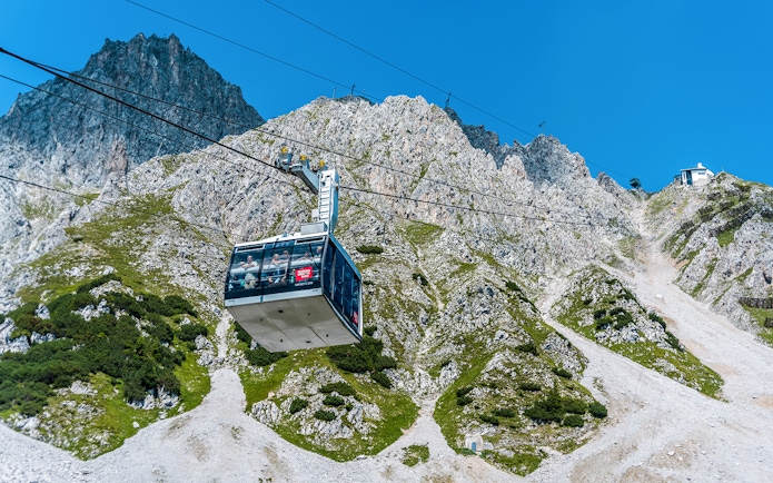 Cable car ascending Nordkette mountain in Innsbruck, Austria.