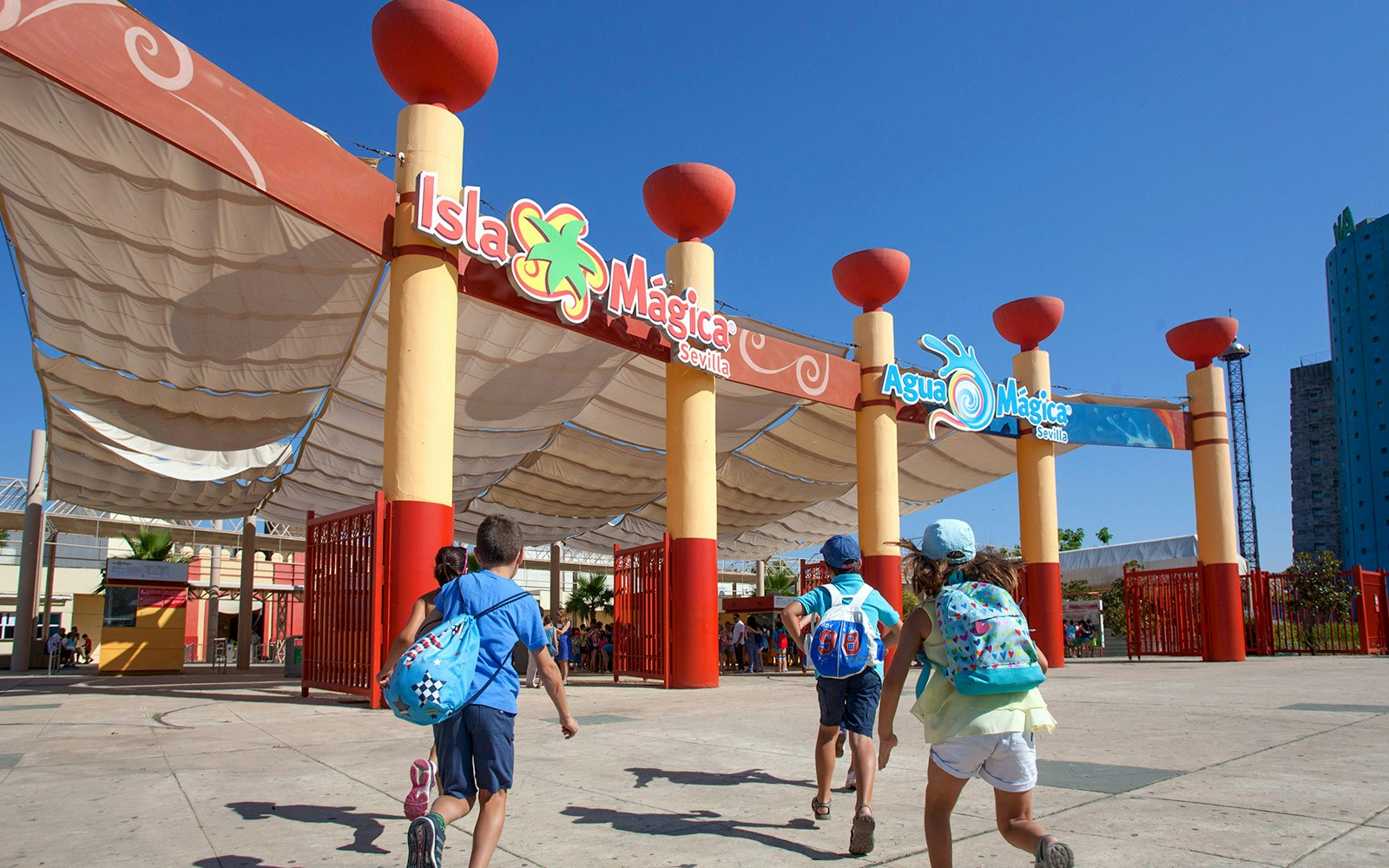 Children entering Isla Mágica amusement park in Seville, Spain.