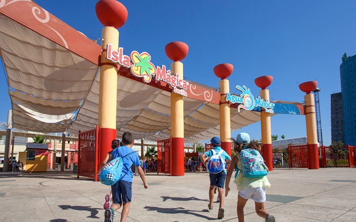 Children entering Isla Mágica amusement park in Seville, Spain.