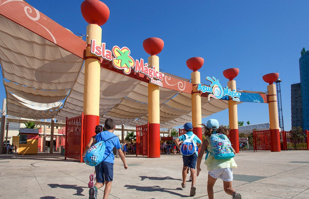 Children entering Isla Mágica amusement park in Seville, Spain.