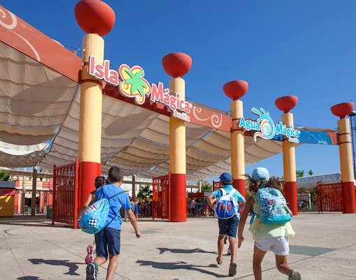 Children entering Isla Mágica amusement park in Seville, Spain.