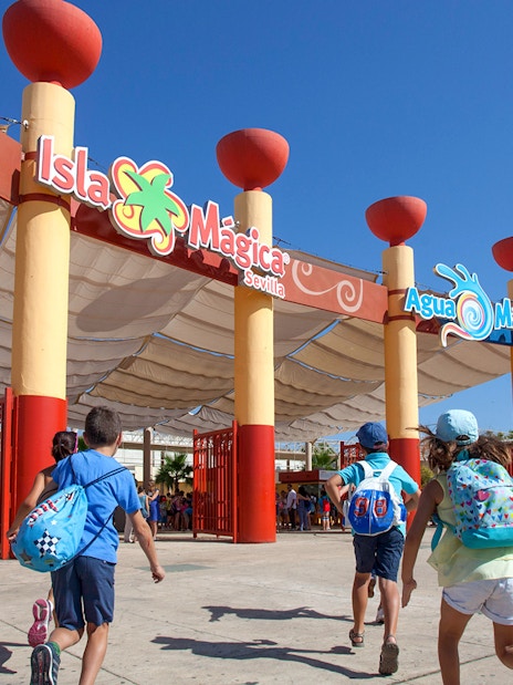 Children entering Isla Mágica amusement park in Seville, Spain.