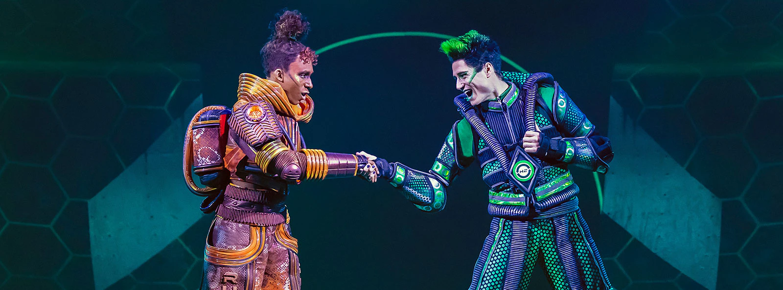 Performers in futuristic costumes on roller skates in Starlight Express show.