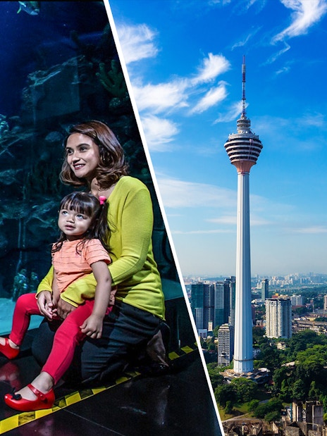 KL Tower and city skyline with family at Aquaria KLCC.