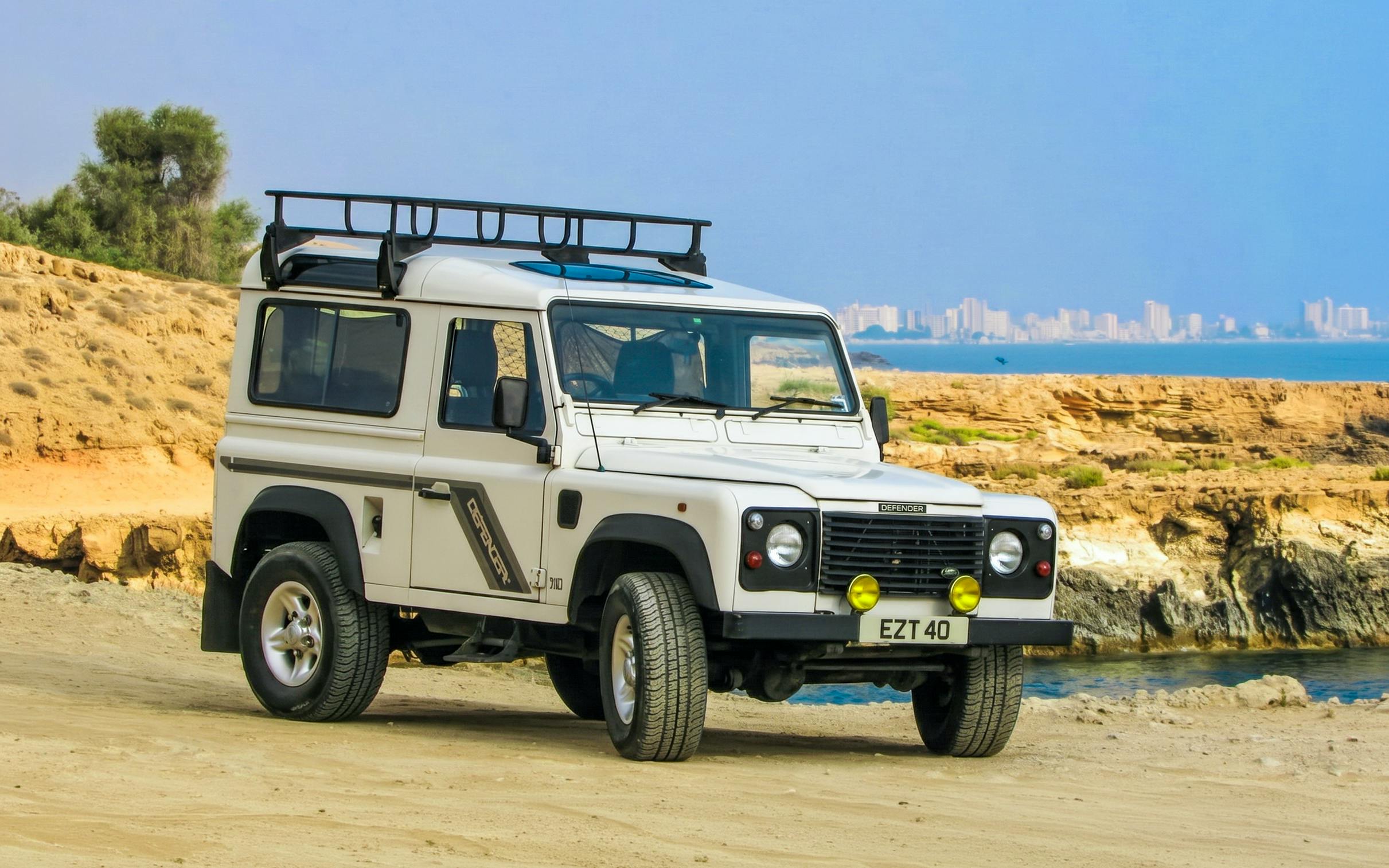 Jeep on a safari tour in the Troodos Mountains, Cyprus, with coastal view.
