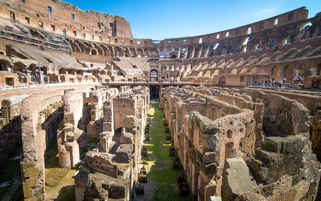 Colosseum underground ruins with ancient stone structures in Rome, Italy.