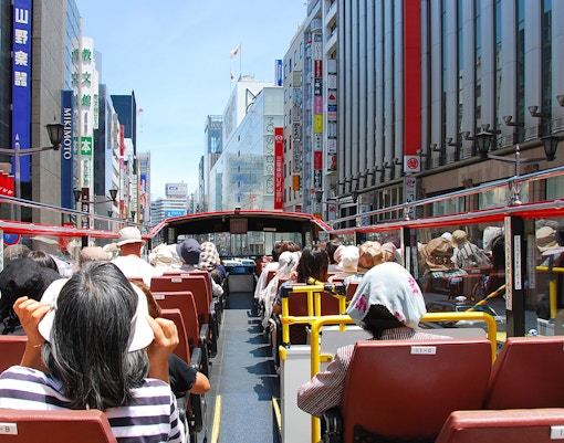 Tourists on Sky Hop bus with Tokyo Skytree in the background