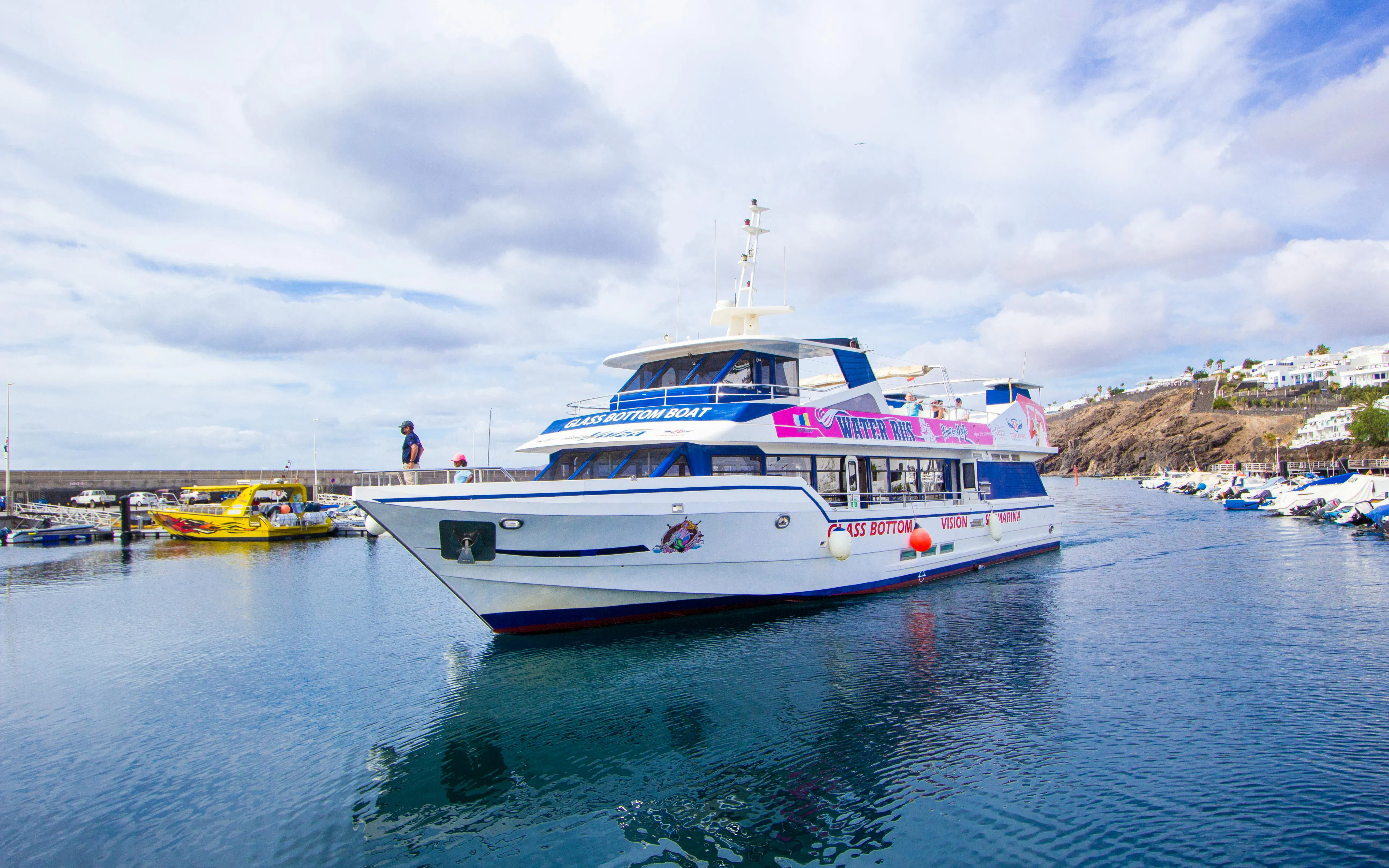 Boat transfer between Puerto del Carmen and Puerto Calero in a glass-bottom vessel.