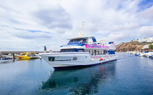 Boat transfer between Puerto del Carmen and Puerto Calero in a glass-bottom vessel.
