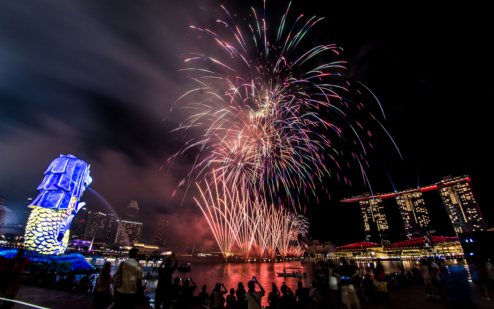 Fireworks display over Marina Bay with Merlion and Marina Bay Sands during F1 Singapore.