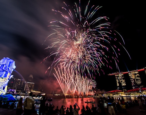 Fireworks display over Marina Bay with Merlion and Marina Bay Sands during F1 Singapore.