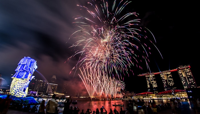 Fireworks display over Marina Bay with Merlion and Marina Bay Sands during F1 Singapore.