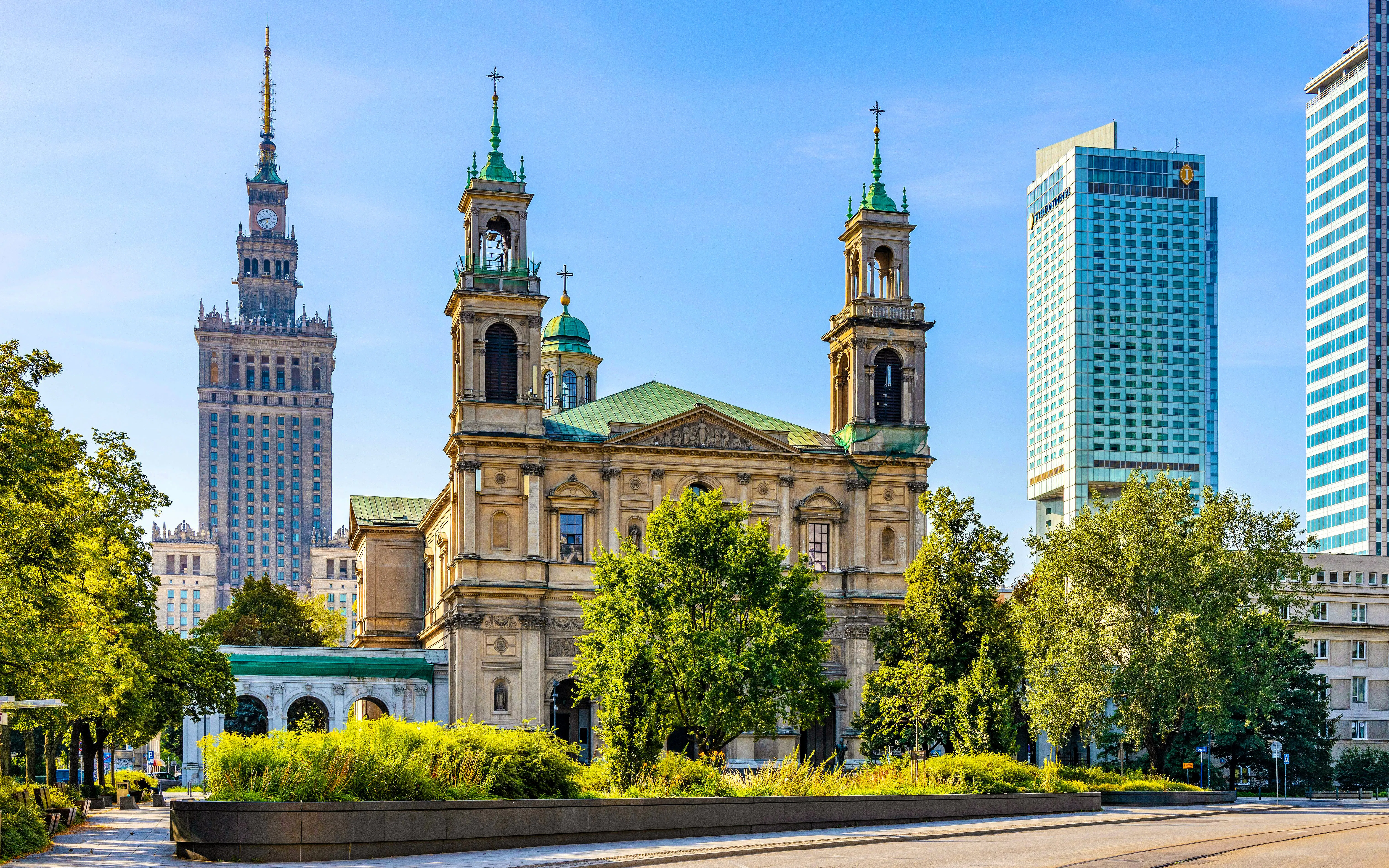 Church of All Saints and Palace of Culture in Srodmiescie District, Warsaw, Poland.