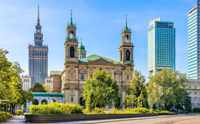 Church of All Saints and Palace of Culture in Srodmiescie District, Warsaw, Poland.
